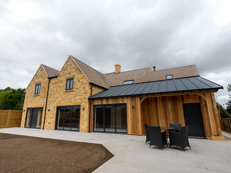 Marleys House, the rear view of the house with wood cladding extension.