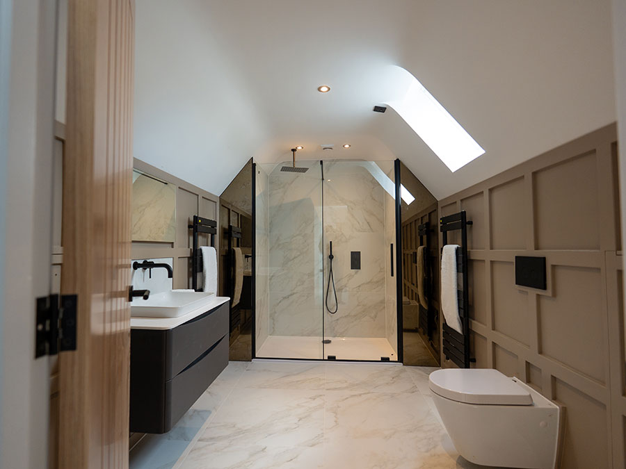 Dark grey and white bathroom with large shower