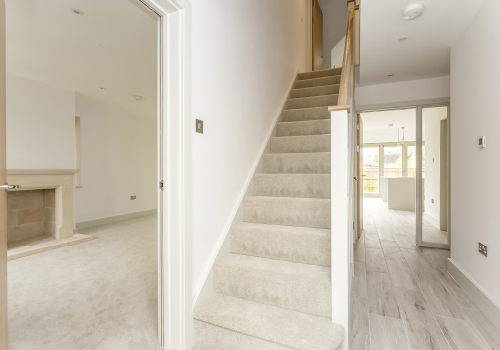 A view of the staircase leading up to the first floor at Compton House.